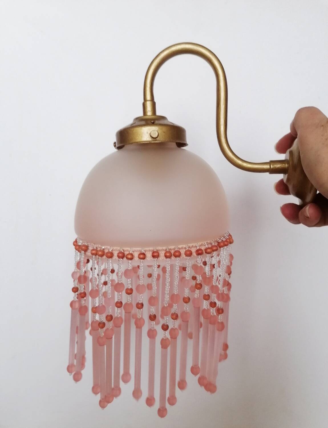 Pink glass wall lamp with garland of pearls