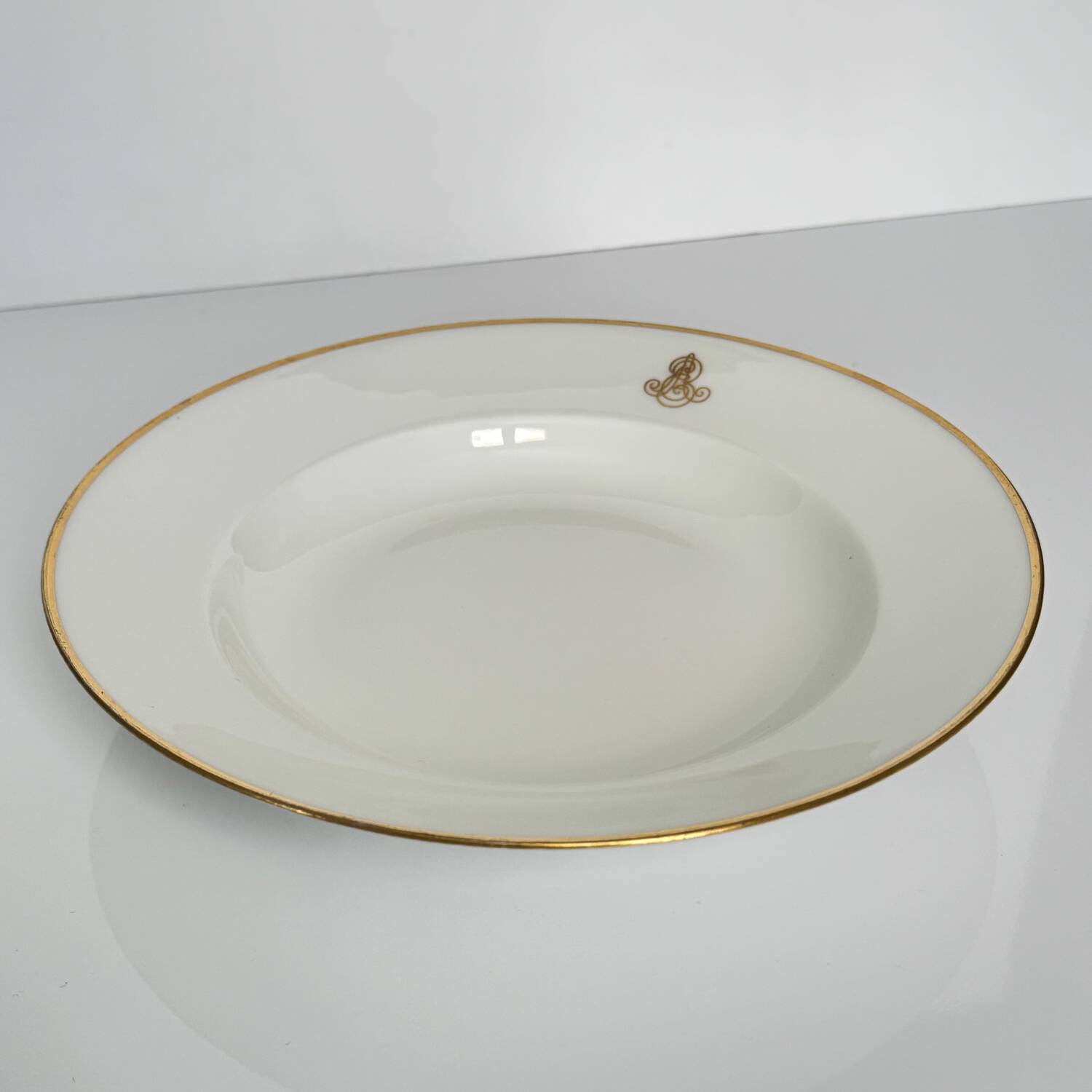 Set of monogrammed plates with gilt edges | E. Bourgeois | Late 19th century
