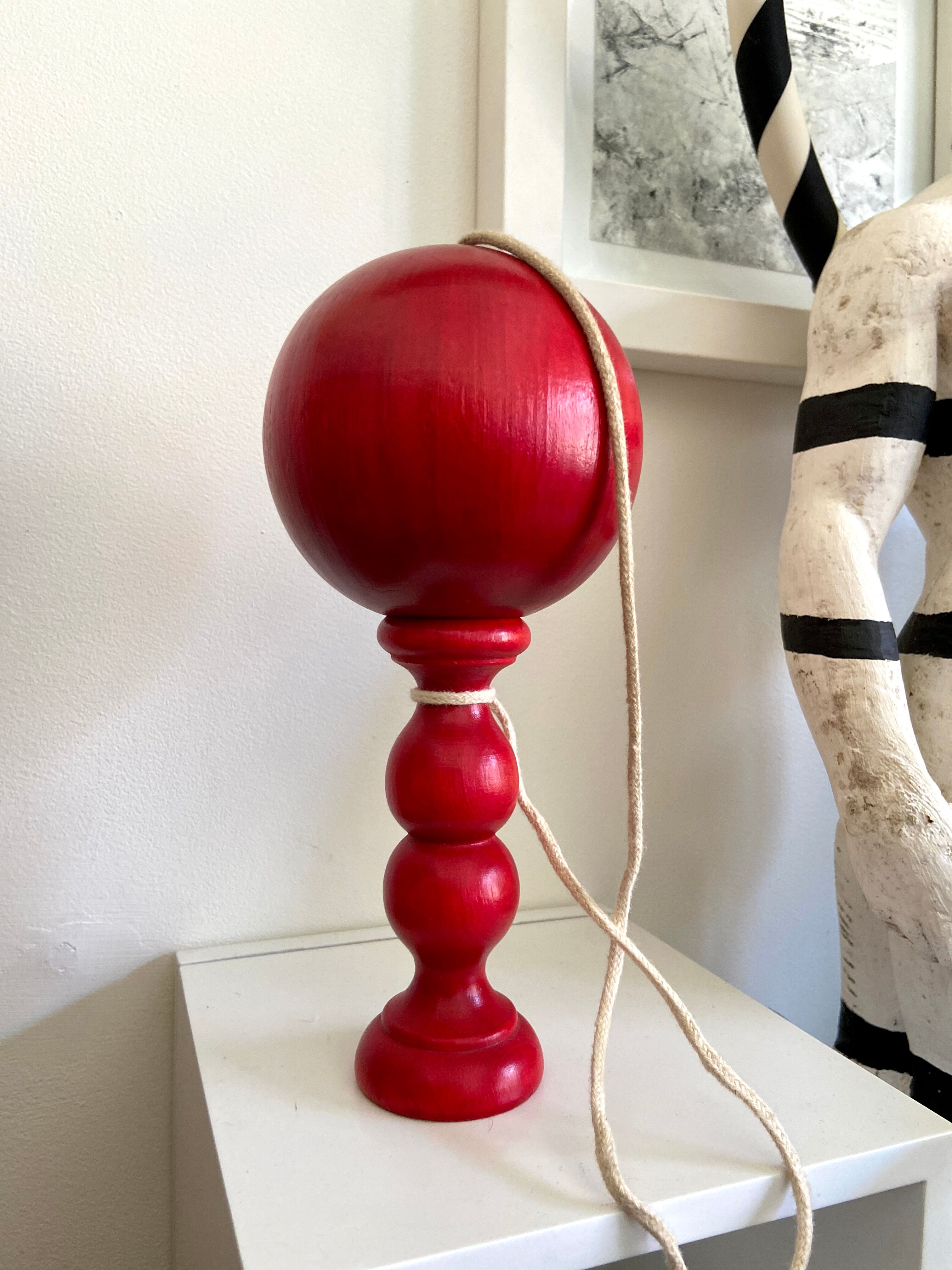 Bilboquet in red wood