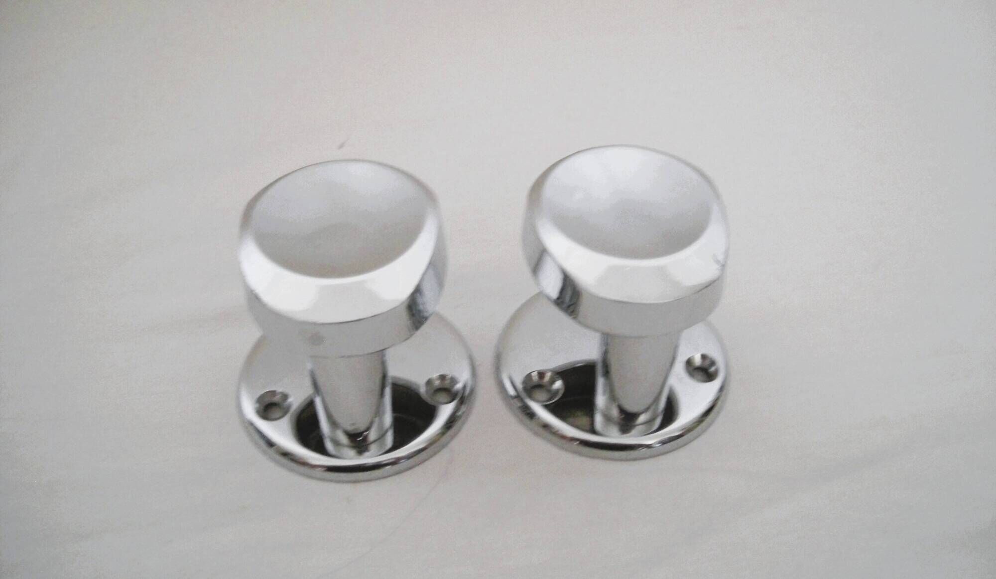 Pair of stainless steel coat racks from the 1970s.