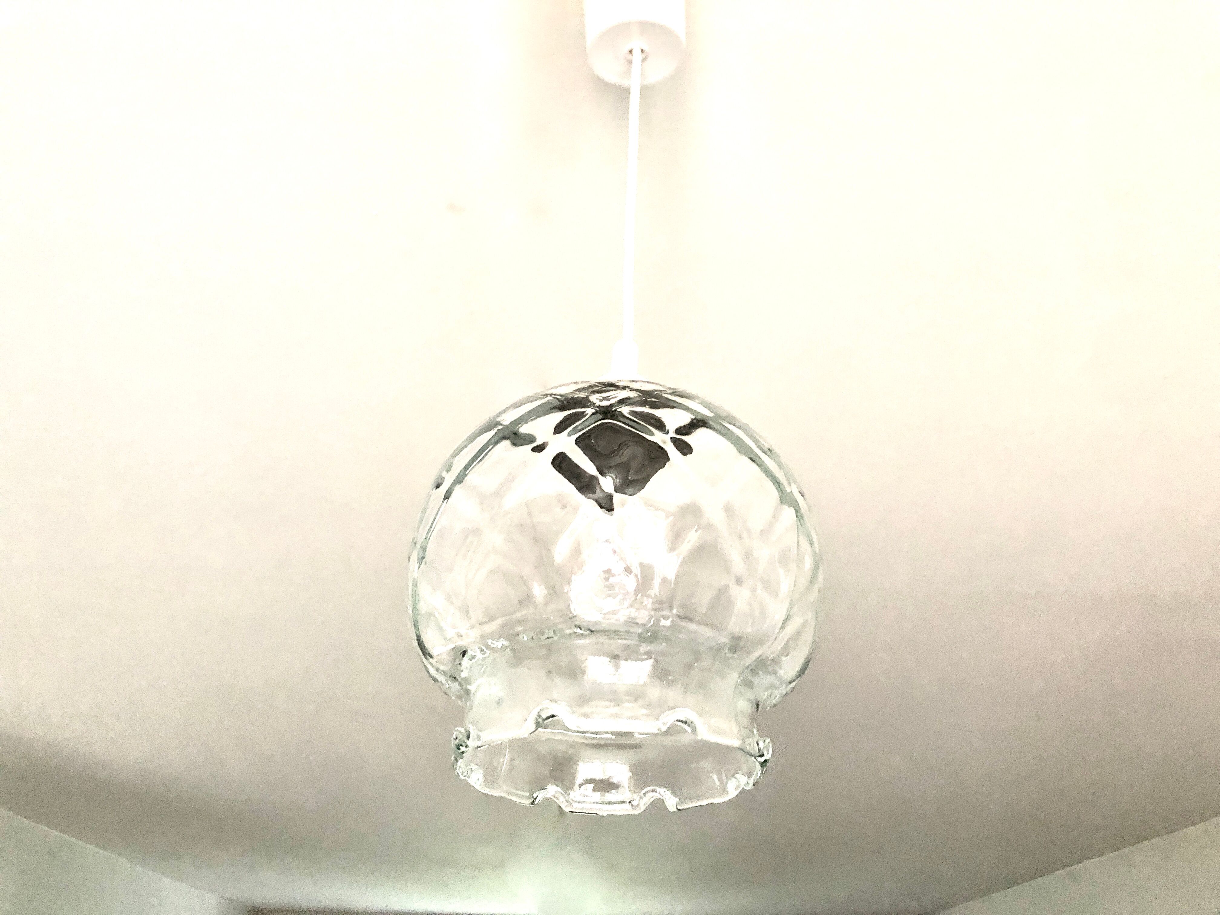 Suspension with transparent checkered glass steering wheels