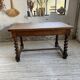 Paneled walnut desk with turned legs, 1900