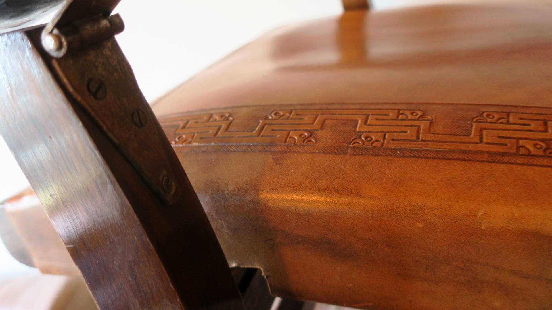 Tiahuanaco design tooled leather folding armchair by Angel Pazmino, Ecuador
