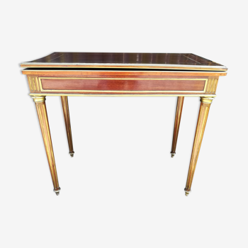 Napoleon III game table in mahogany and brass