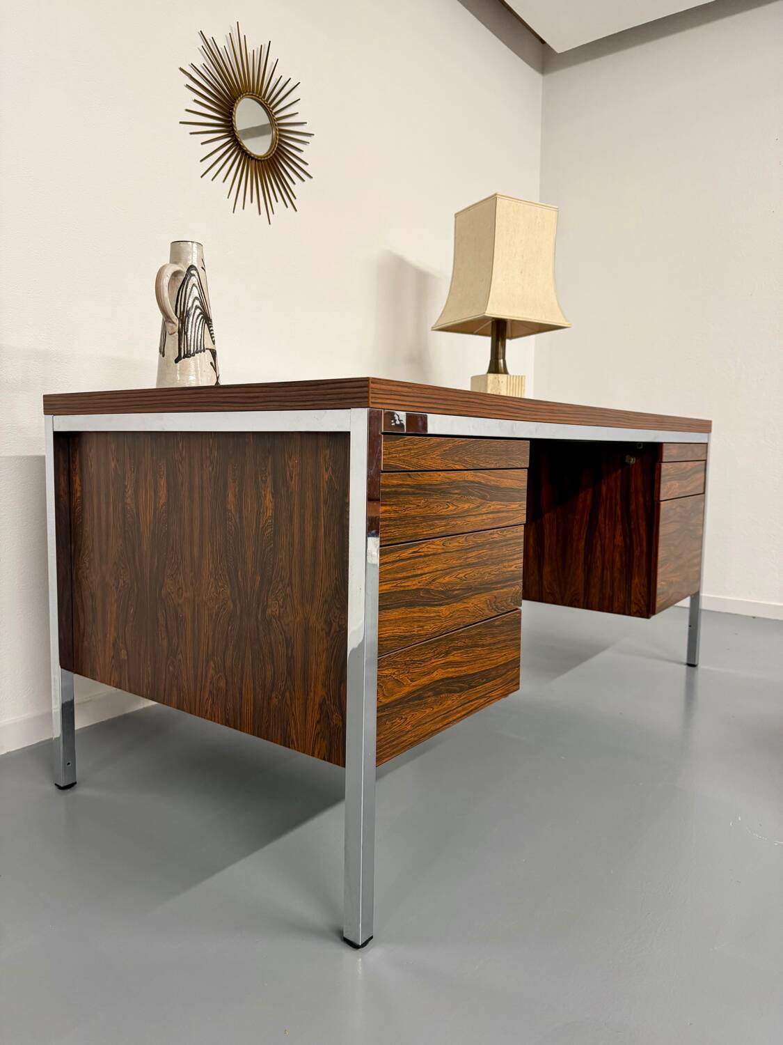 Vintage desk with rosewood veneer and chrome metal design from the 1970s.