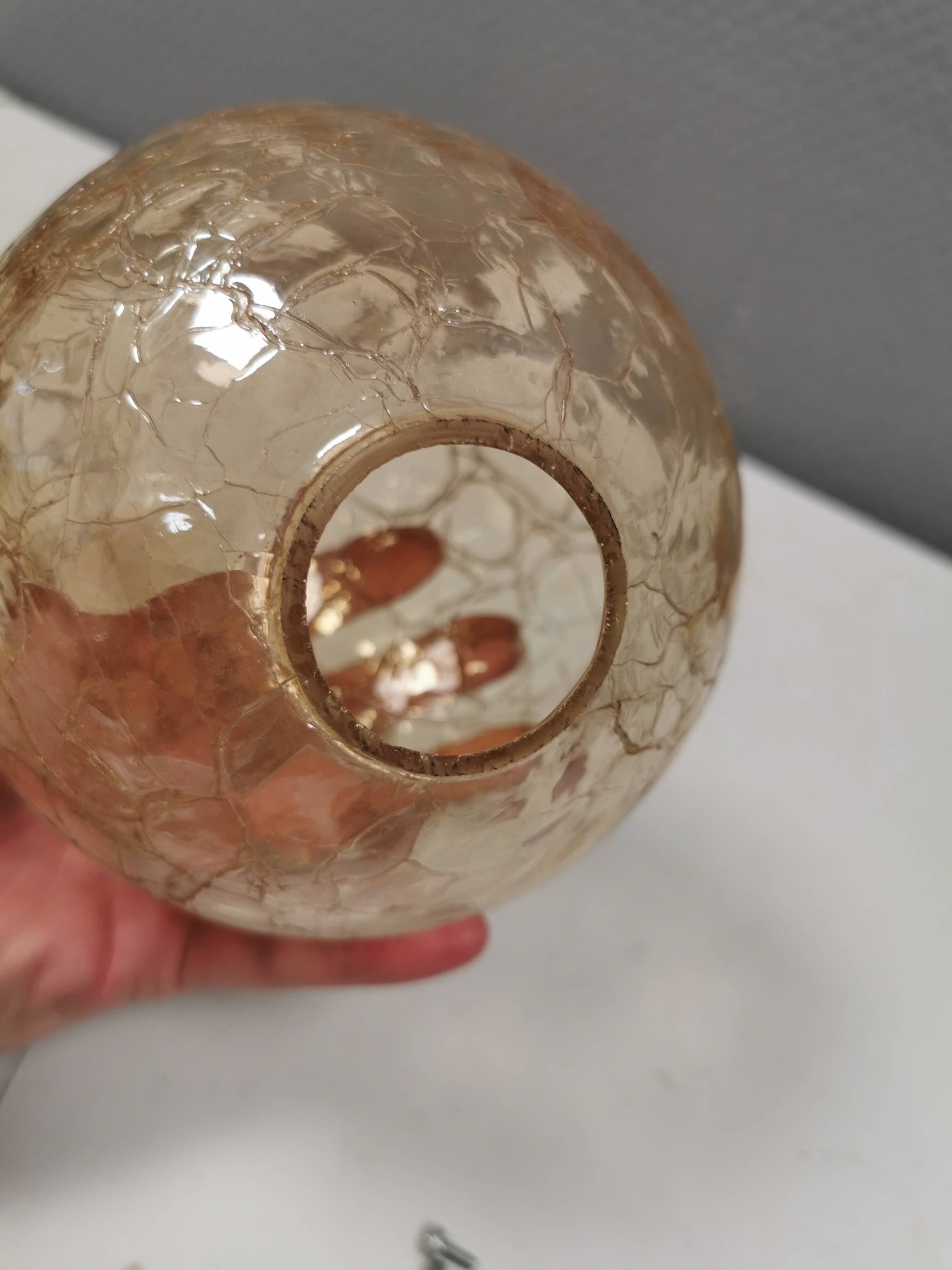 Older wall lamp in metal, brass and “cracked” glass.