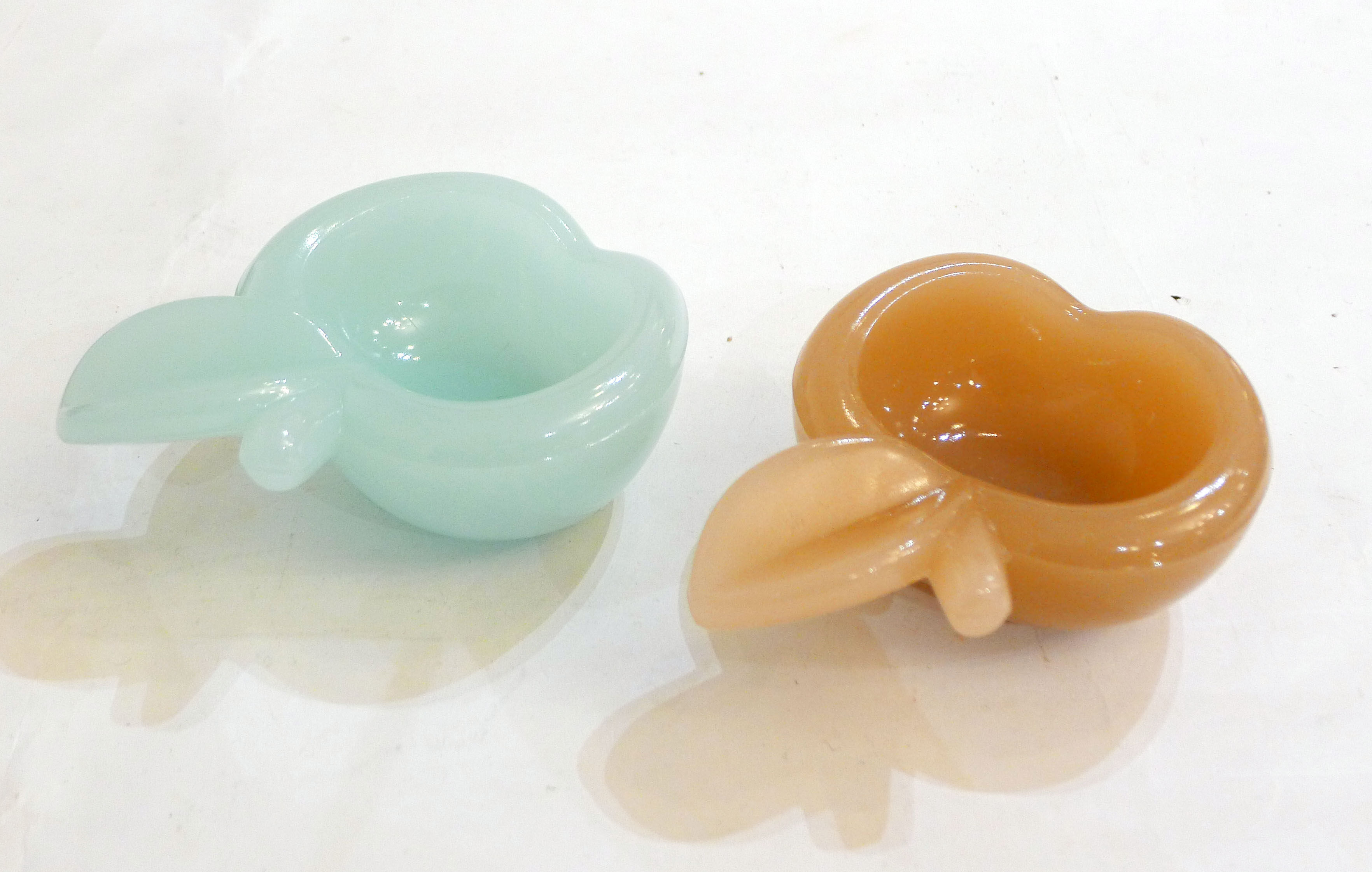 Pair of Apple opalin ashtrays