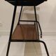 Red scoubidou handles wheeled serving table