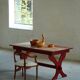 Rustic farmhouse dining table in painted red pine, Sweden, 1920s.