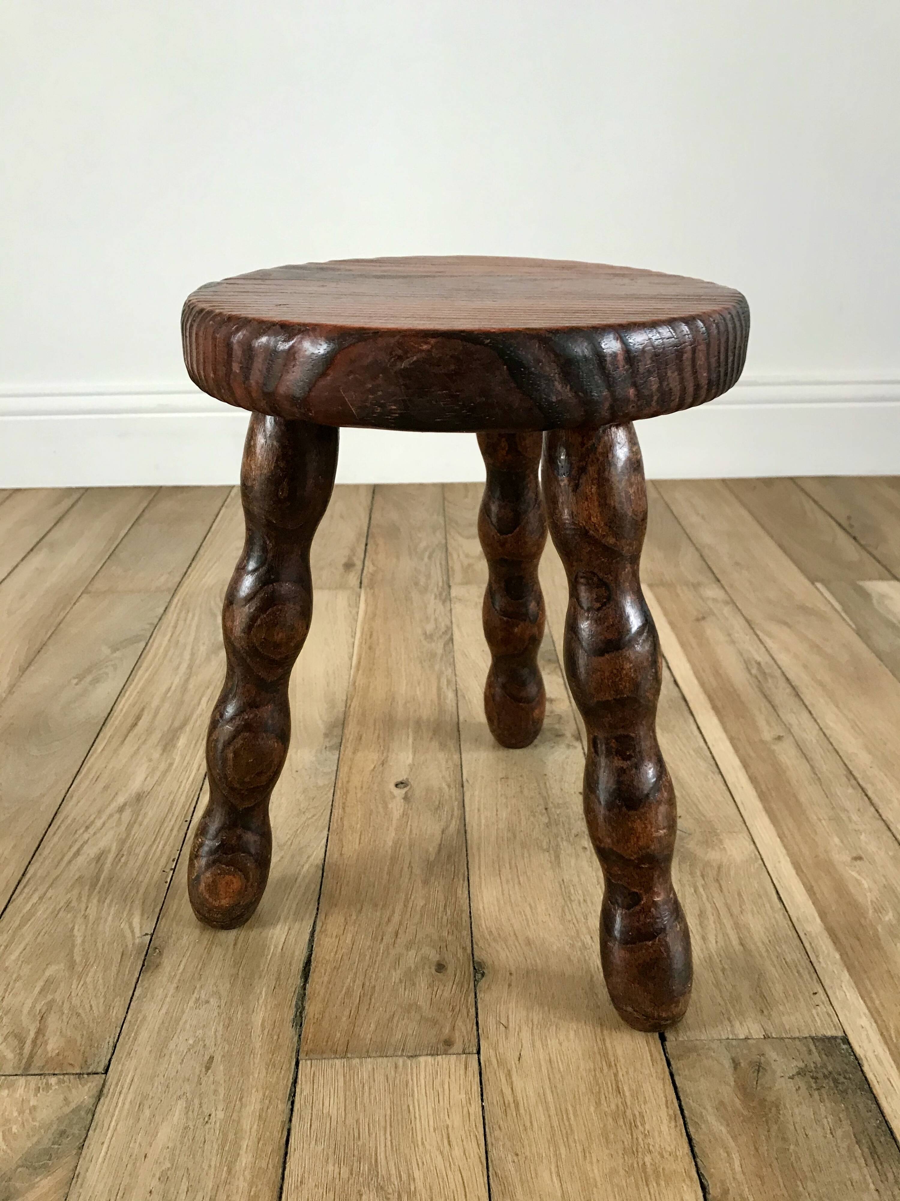 low stool in solid turned wood from the 70s