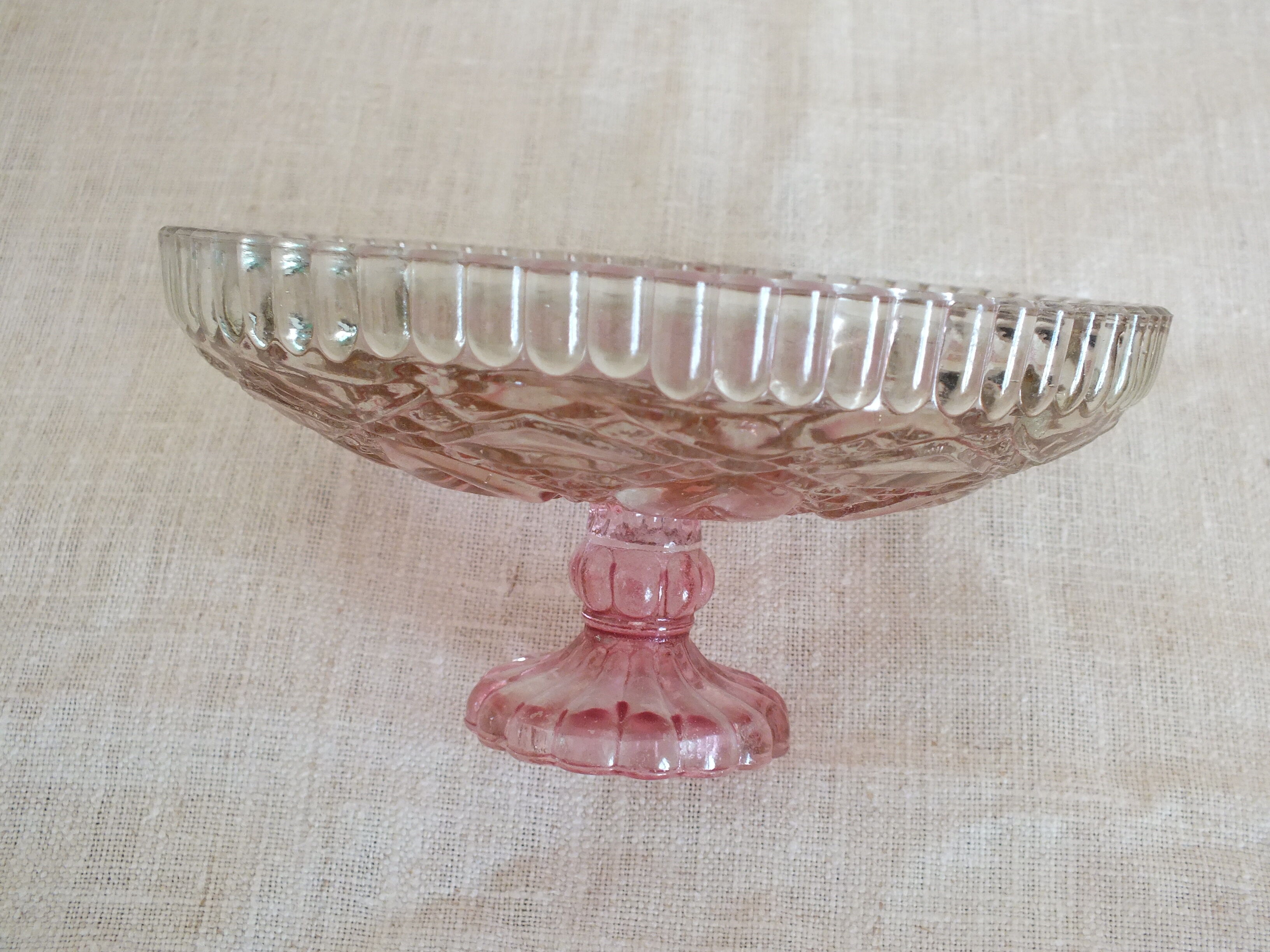 Small pink tinted molded crystal display cup