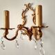 Rococo-style wall lamp in gilded bronze and crystal stamps