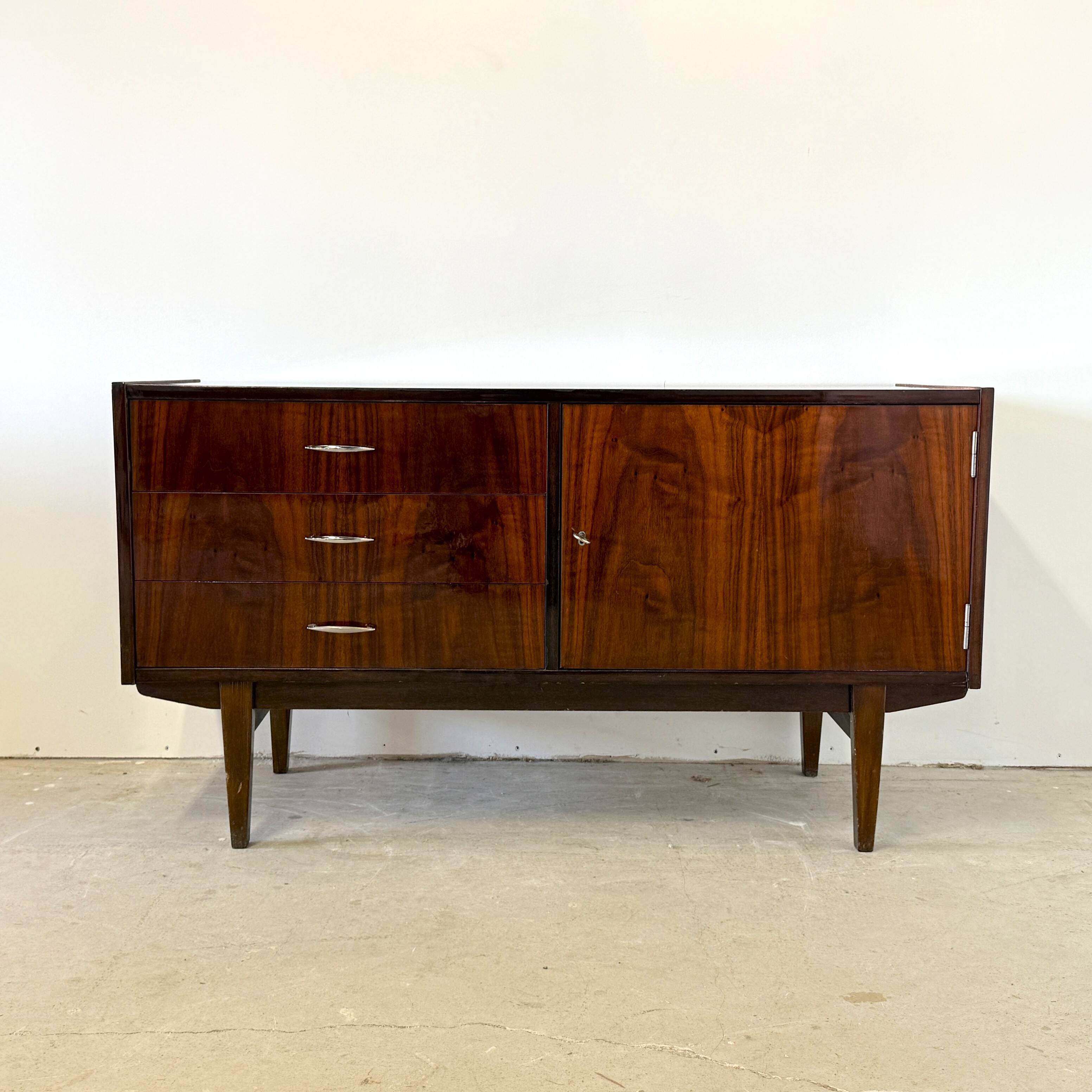 Subtle high-gloss sideboard in Scandinavian style