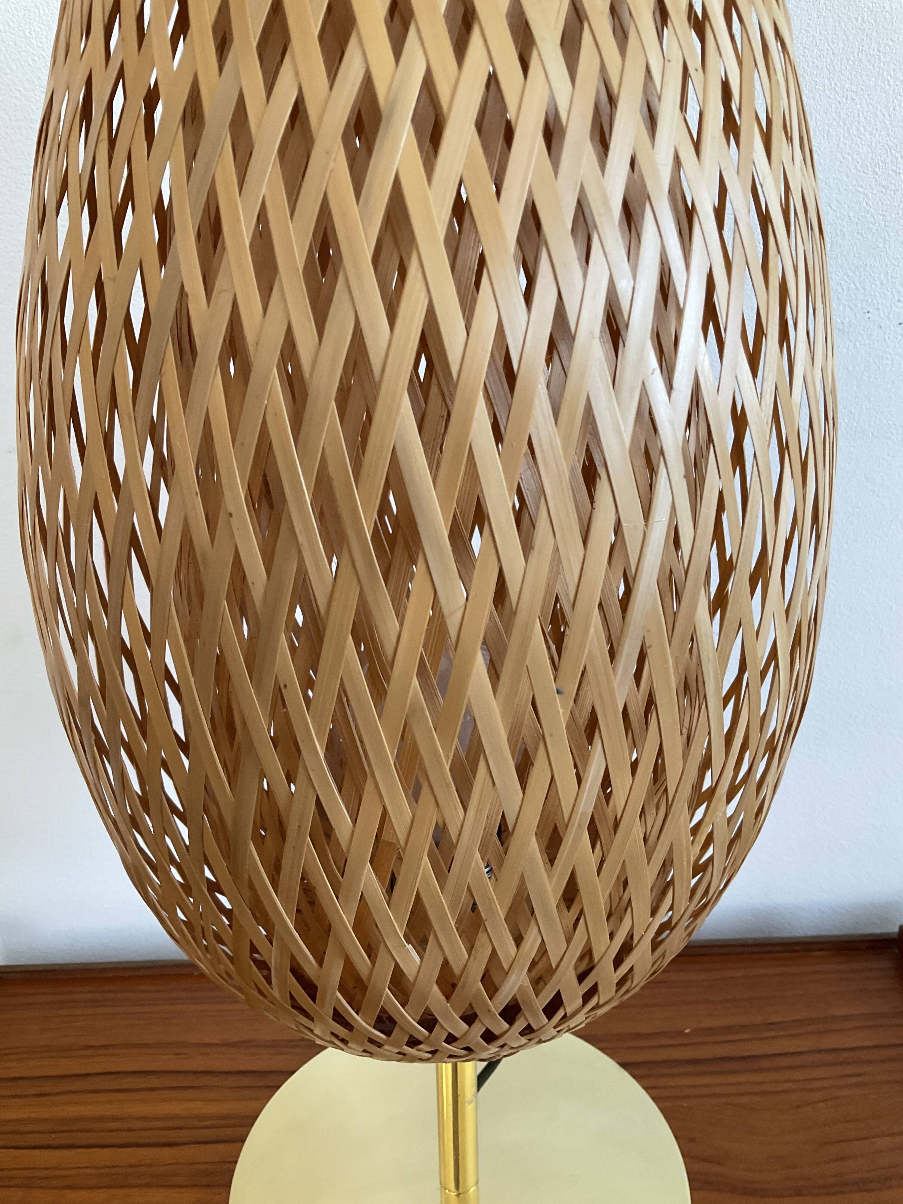 Design lamp in gold metal and wicker