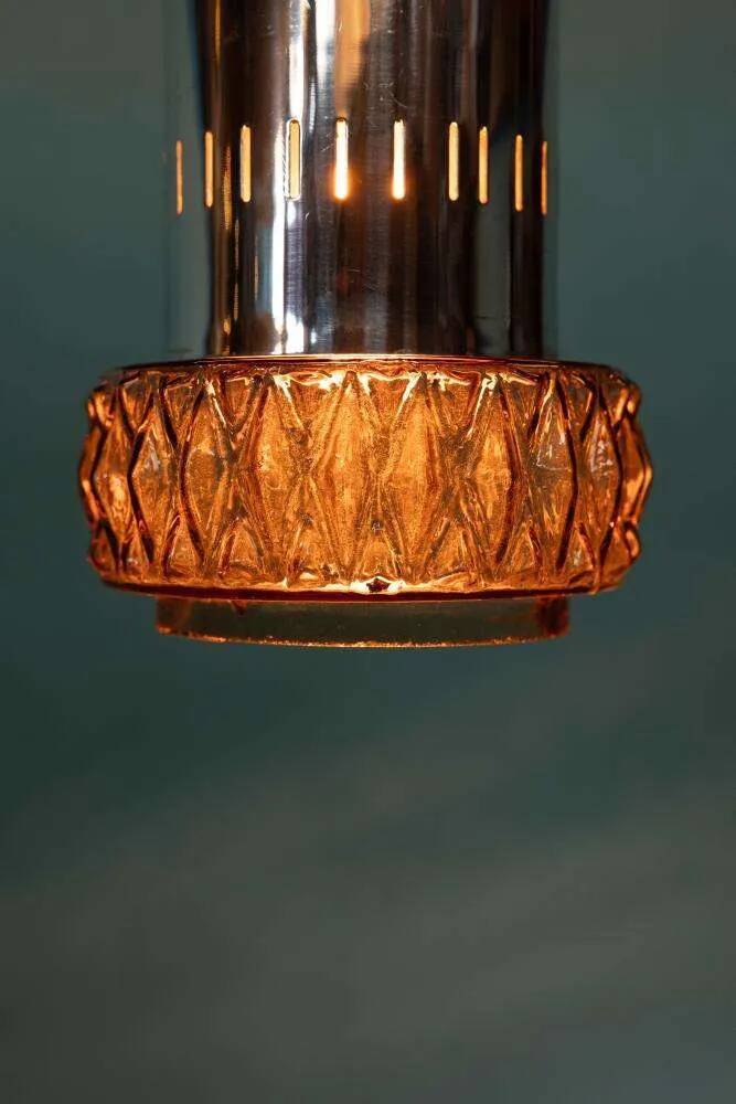 Suspended glass from the space age, mid-century glass from the 1960s.