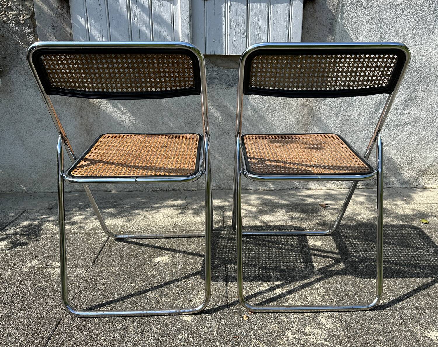 Pair of vintage metal caned folding chairs