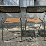 Pair of vintage metal caned folding chairs