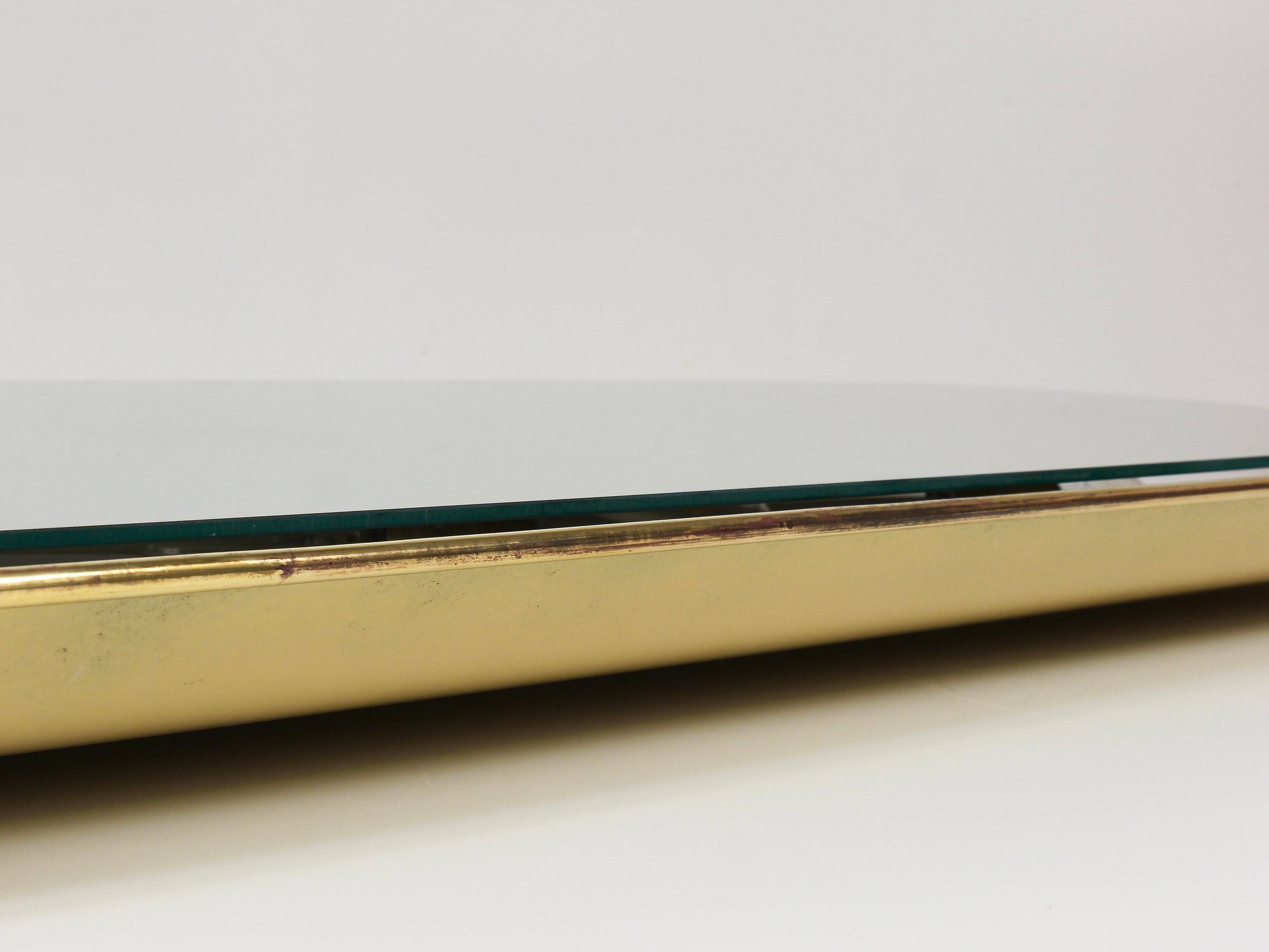 Mid-century illuminated wall mirror by Ernest Igl with brass crown, by Hillebrand.