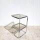 Vintage 1970s side table in chrome metal and smoked glass.