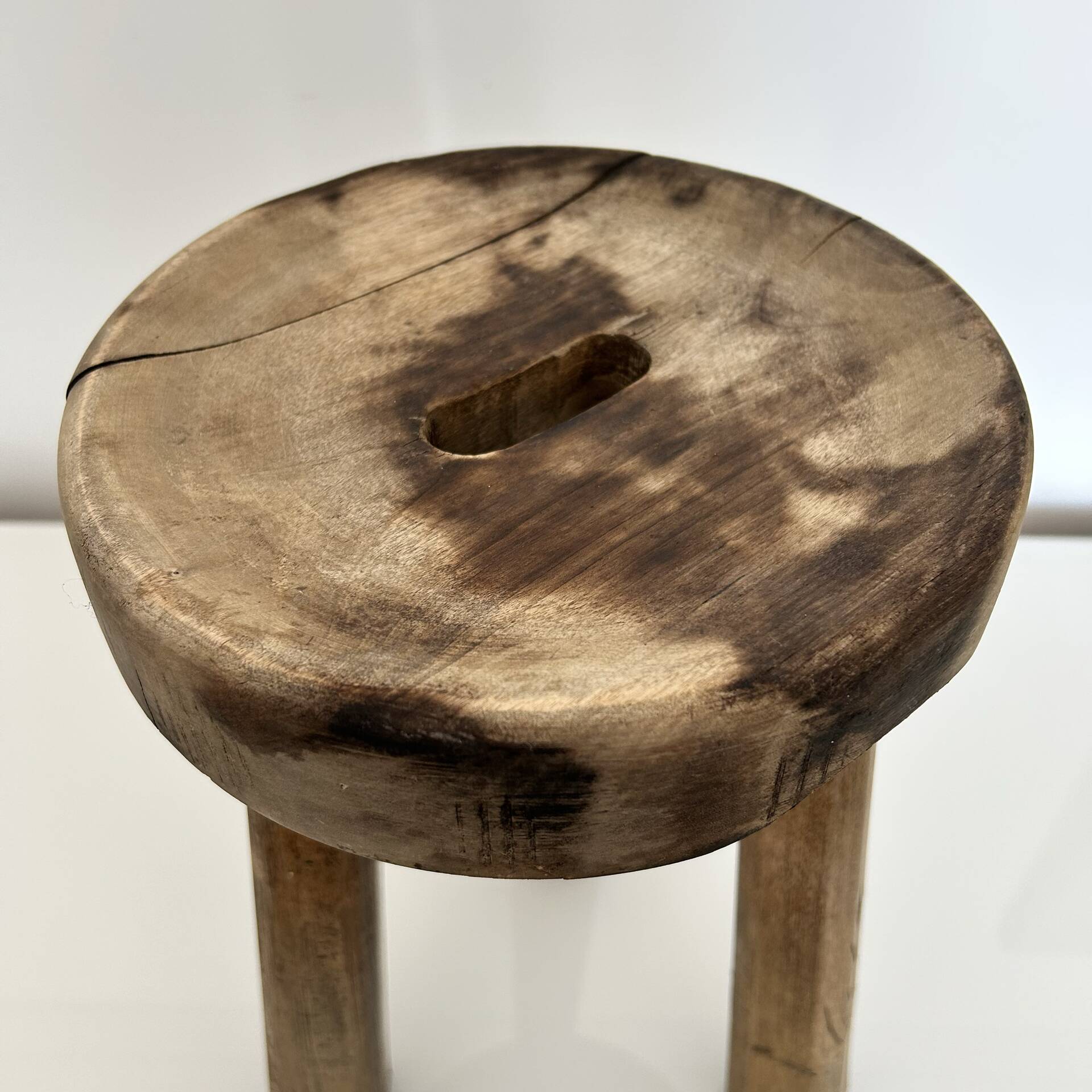 Patinated tripod stool