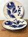 duo of porcelain dessert plates with hand-painted floral decoration
