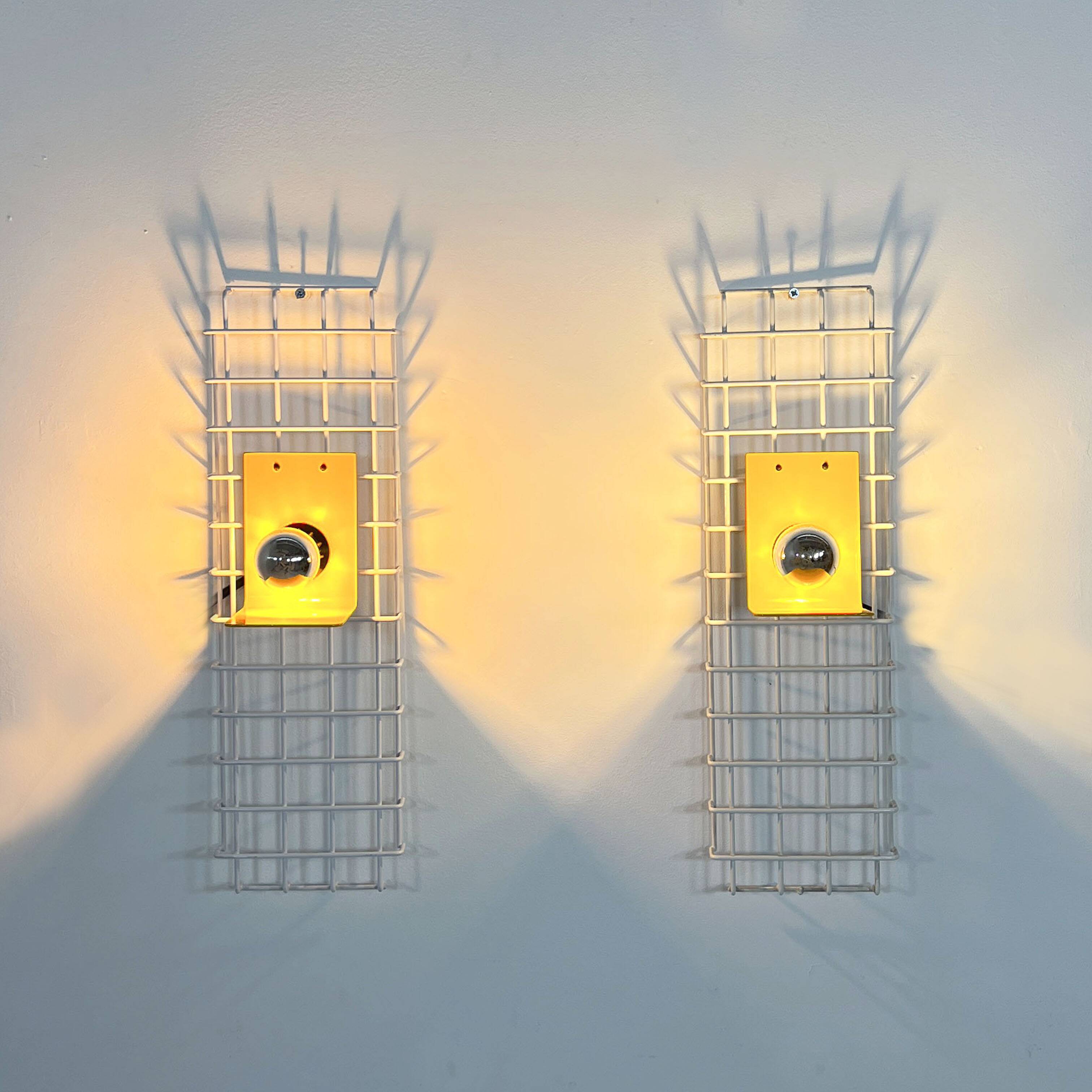 Pair of yellow wall sconces on wire mesh by Seccose, 1980