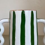 Green and white striped ceramic vase with abstract handmade corrugated handheld