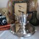 Old English coffee pot in silver-plated metal and Bakelite.