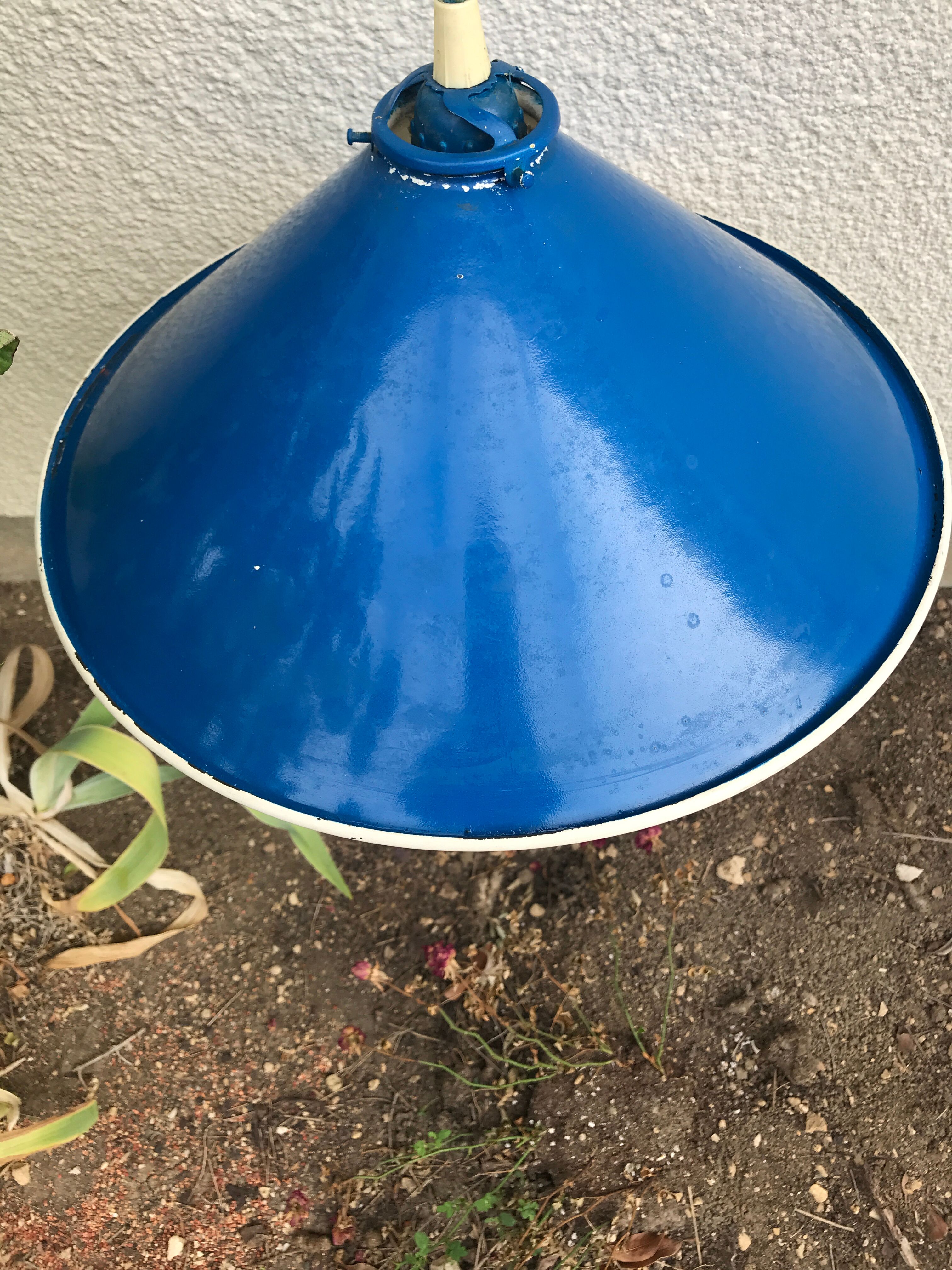 Blue and white painted metal hanging and its mount and drop