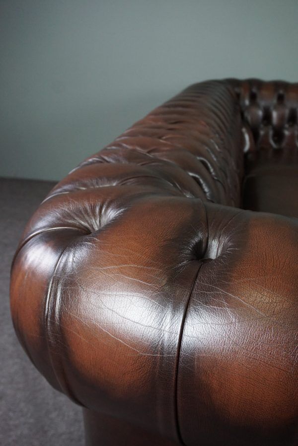 Chesterfield sofa in cowhide, 4 seats