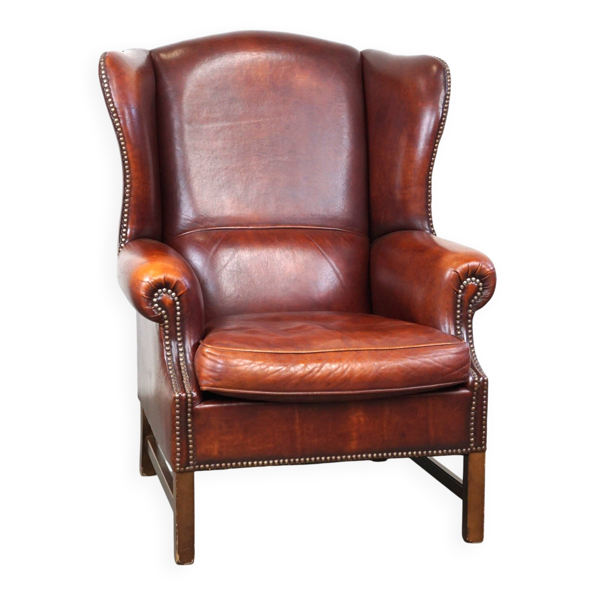 Large comfortable sheepleather wingchair in good condition and beautiful colours