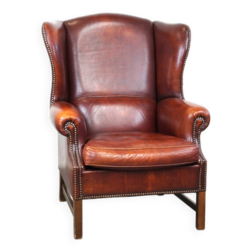 Large comfortable sheepleather wingchair in good condition and beautiful colours