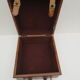 Rectangular wooden suitcase covered with leather