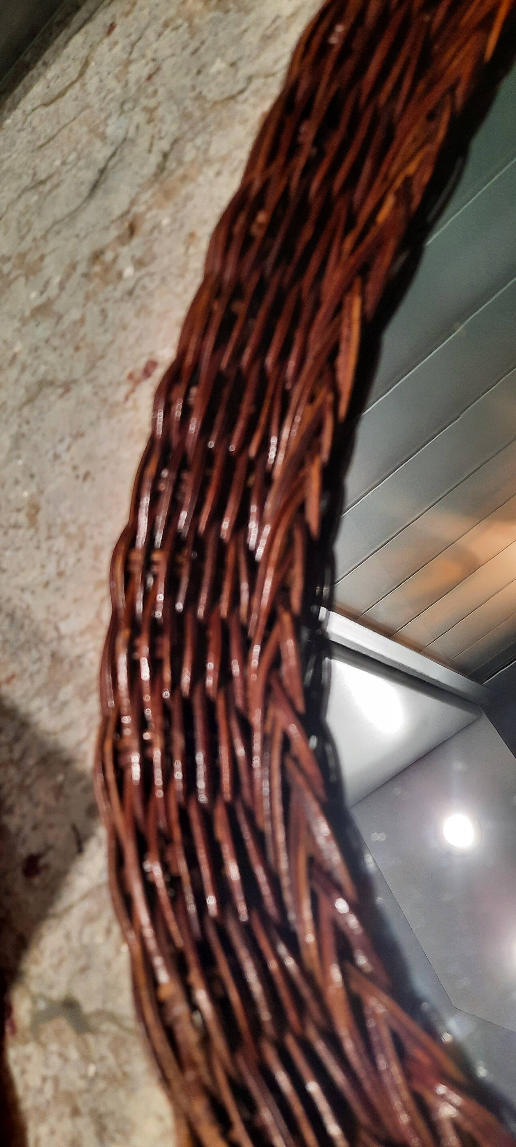 Vintage woven wicker oval mirror