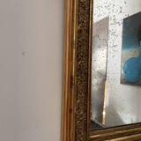 Antique mirror in gilded wood