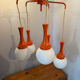 Suspension cascade design Space age orange vintage from the 70s.