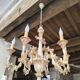 Florentine chandelier in carved wood with polychrome patina.