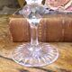 Cut crystal white wine glasses with a slender baluster-shaped stem.