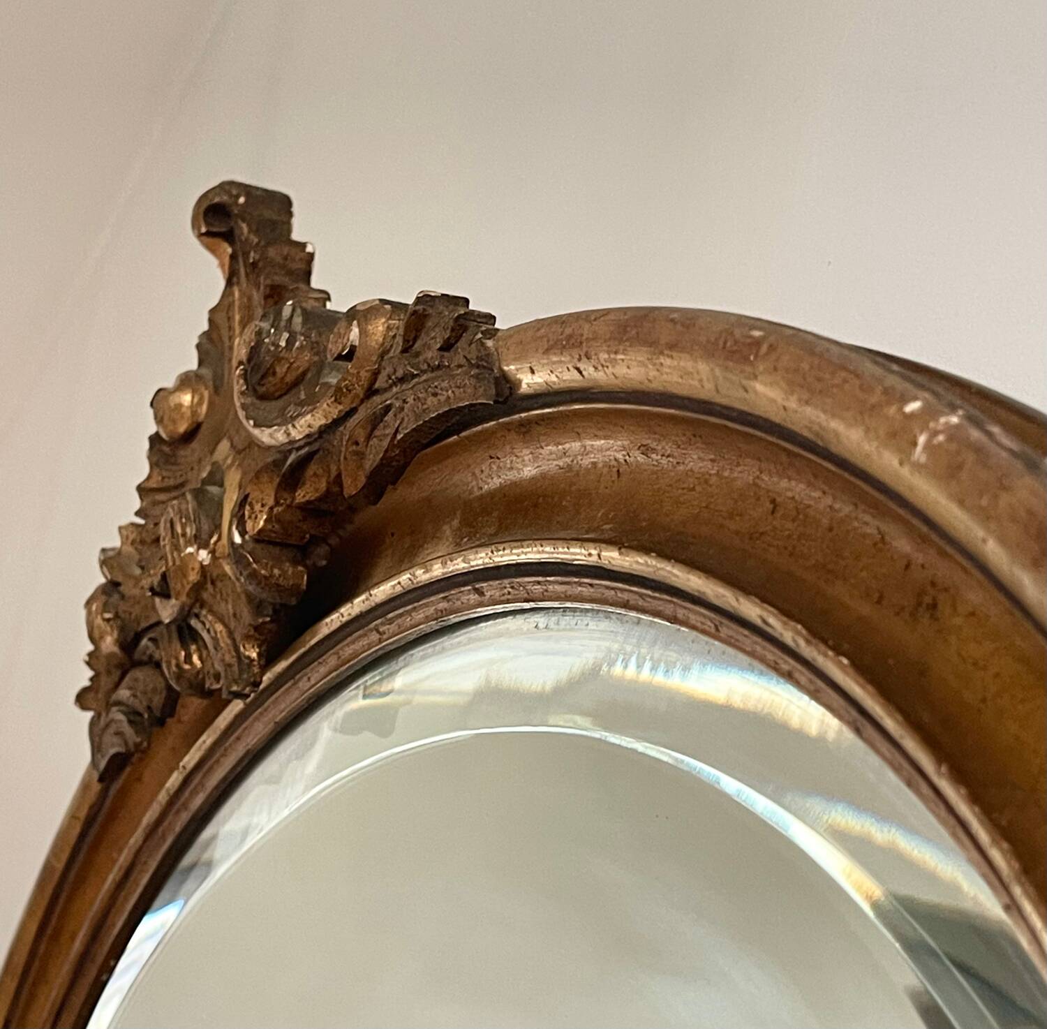 Antique oval gilt mirror.