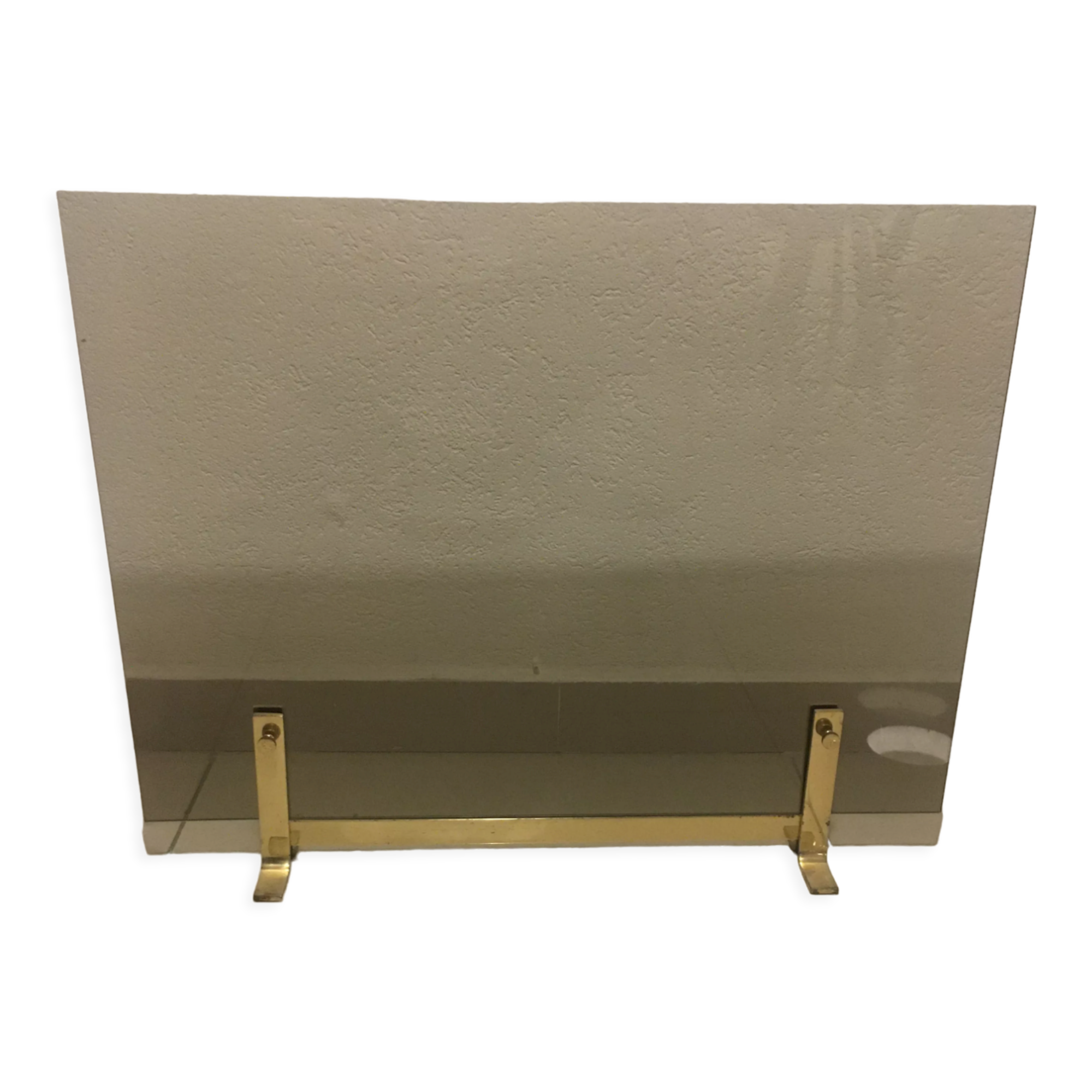 Fireplace screen in smoked glass and brass