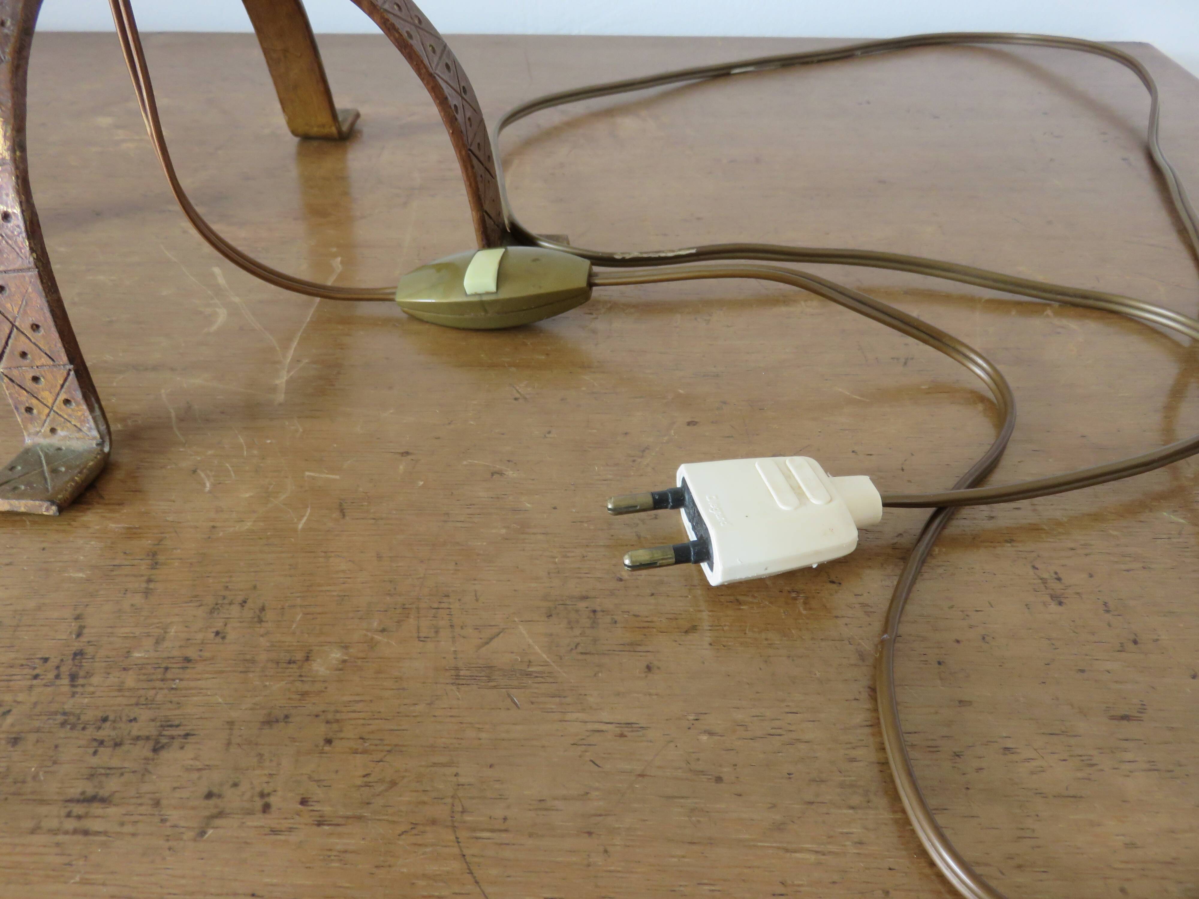 Large "Arts & Crafts" style lamp in beaten iron with a golden patina.