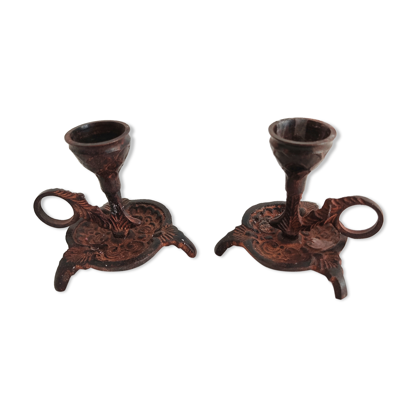 Pair of bronze hand-held candlesticks