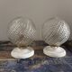 Set of two chiseled glass globe wall lights
