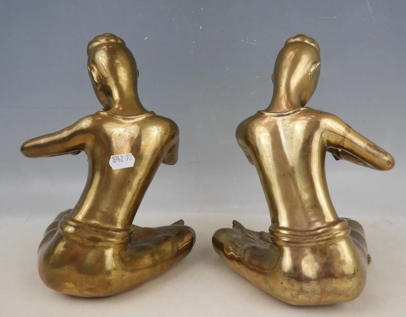 Pair of bookends in brass, flute players