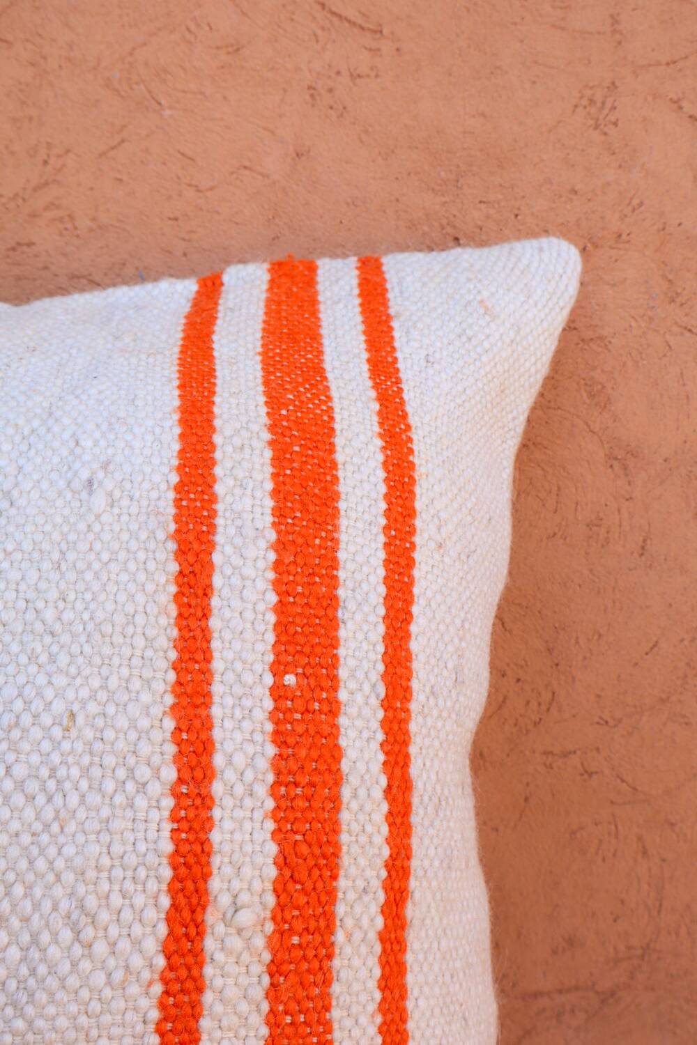 Orange and white striped handmade wool cushion