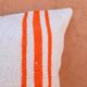 Orange and white striped handmade wool cushion