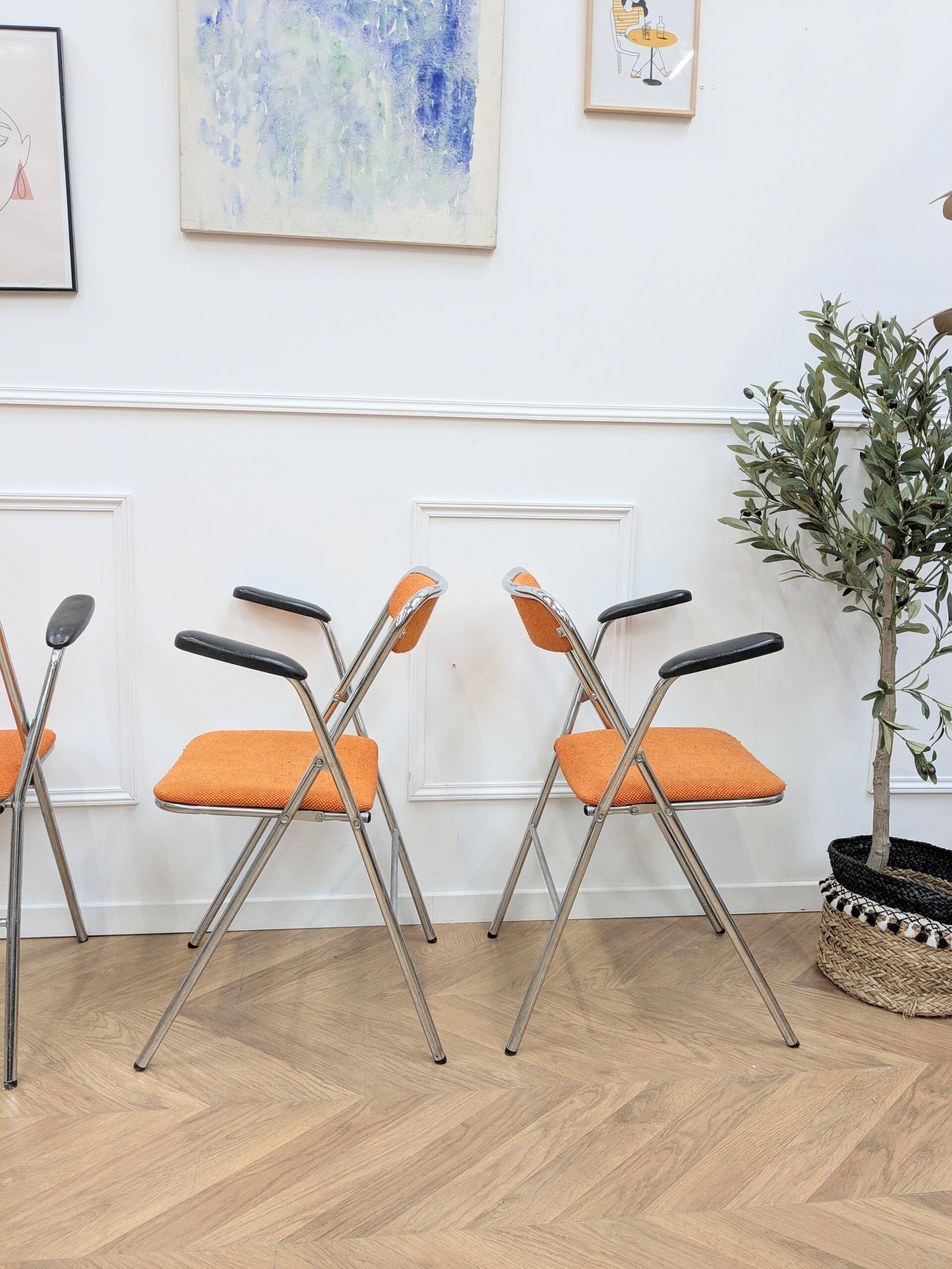 6 orange folding chairs