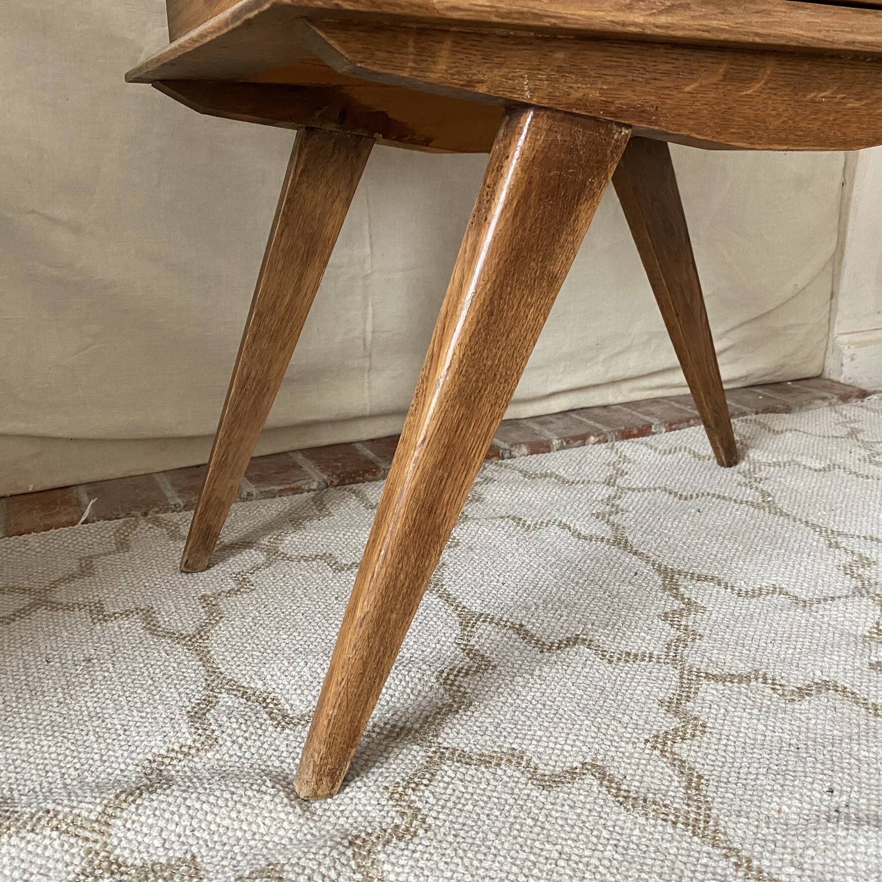 Scandinavian style bedside table with tapered legs from the 1960s.
