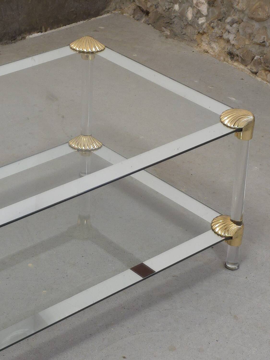 Coffee table, living room table in glass with two tiers, adorned with golden seashells, 1970.