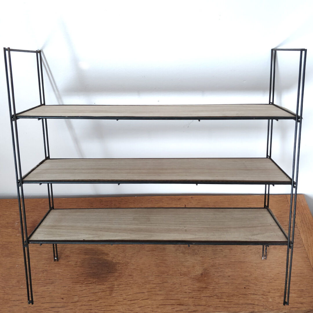 Metal wall thong shelf